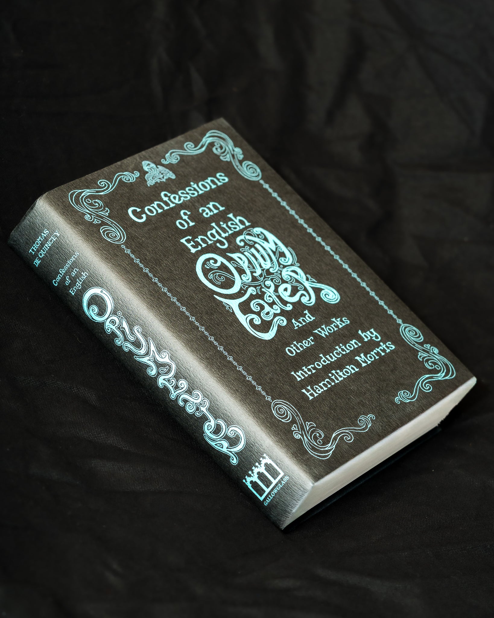 A hardcover book titled 'Confessions of an English Child' by Thomas De Quincey. The book features a cover illustrated by Hernan Conde de Boeck and an introduction by Hamilton Morris. 